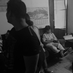 Boy sitting alone on couch