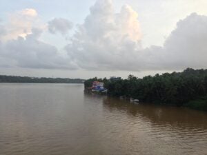 Beauty of the backwaters of Kerala (that is Mutthapan temple on the bank)